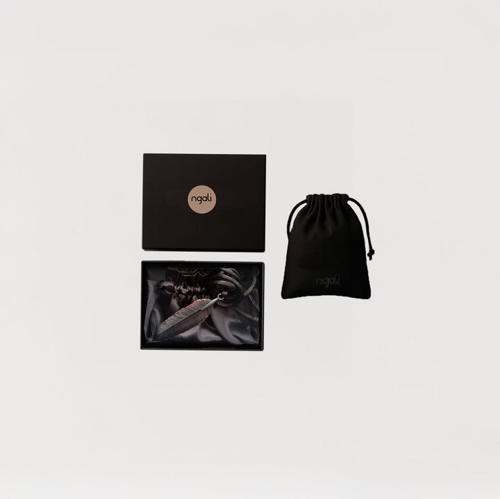 Carved Feather Pendant